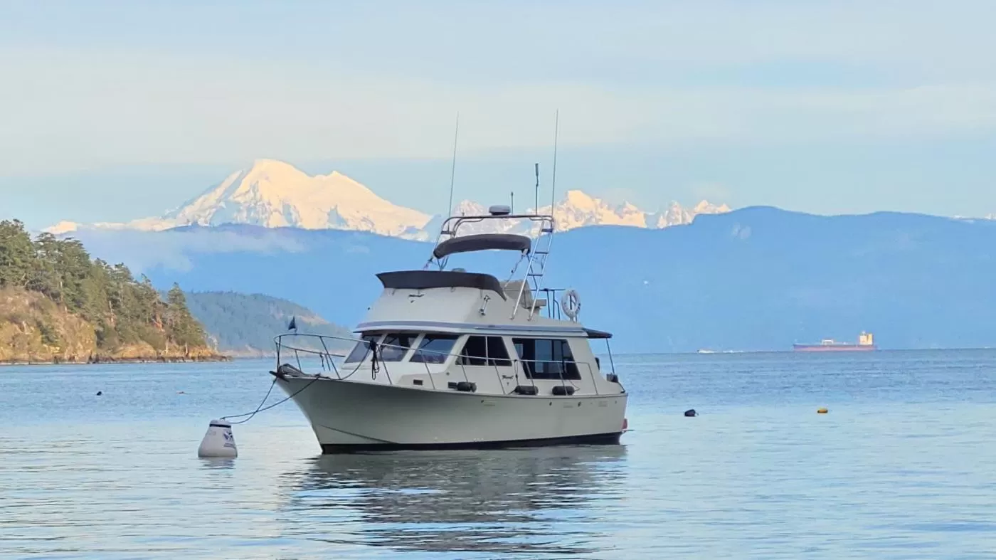 Maria Faires' boat Tollycraft Little Bear in Eagle Harbor San Juans with Mt. Baker in the back