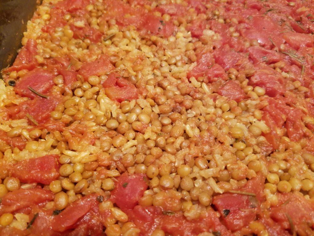 Cooked recipe of rice, lentils and tomatoes for vegetarians