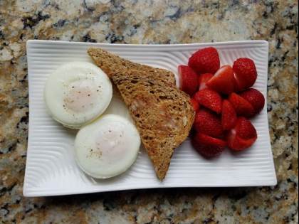 Eggs made in my favorite poached egg pan!! Served with Dave's Killer Bread Thin Slices with Brummel and Brown Spread.