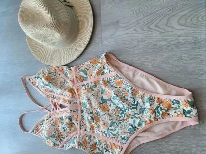 Flattering Swimsuit and Brimmed Hat