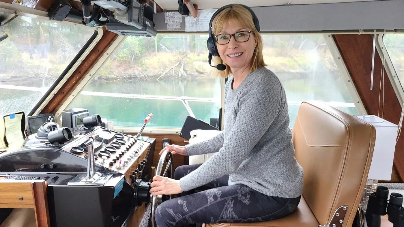 Boat Captain Maria Faires Driving the boat