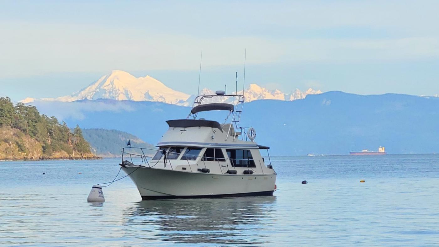Picture of a boat with mountain in the background