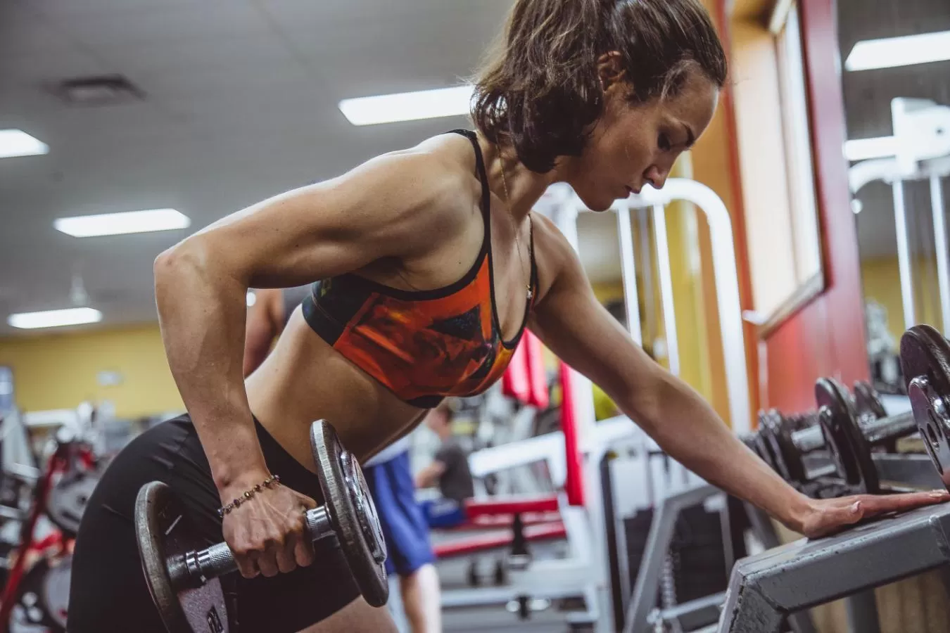woman working out with a weight