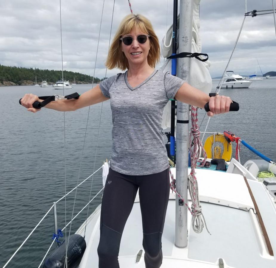 Maria Faires, RD exercising on a boat