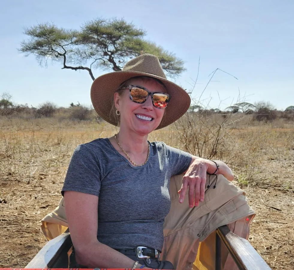 Maria Faires, RD sitting in Kenya