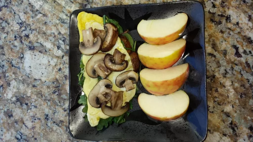 omelet and apple on a plate